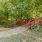 outdoor walking path with a red bridge